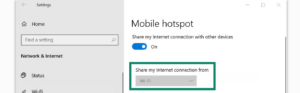 The Windows Mobile hotspot settings screen showing Wi-Fi selected as the internet connection, with a green box highlighting the Mobile hotspot toggle switch set to On.