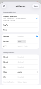 The App Store 'Add Payment' screen showing payment method options including 'None', and a Billing Address form with 'Alaska' selected as the state.