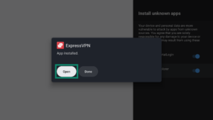 Installation popup window for the ExpressVPN APK app on an Android TV. The Open button is highlighted.